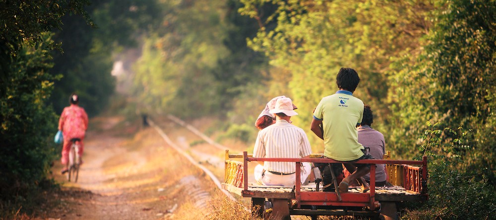 A homemade train or "Norry" made of bamboo and powered by a 6 horsepower gasoline engine travels along the Bamboo Train line, O Dambong, Battambang, Cambodia